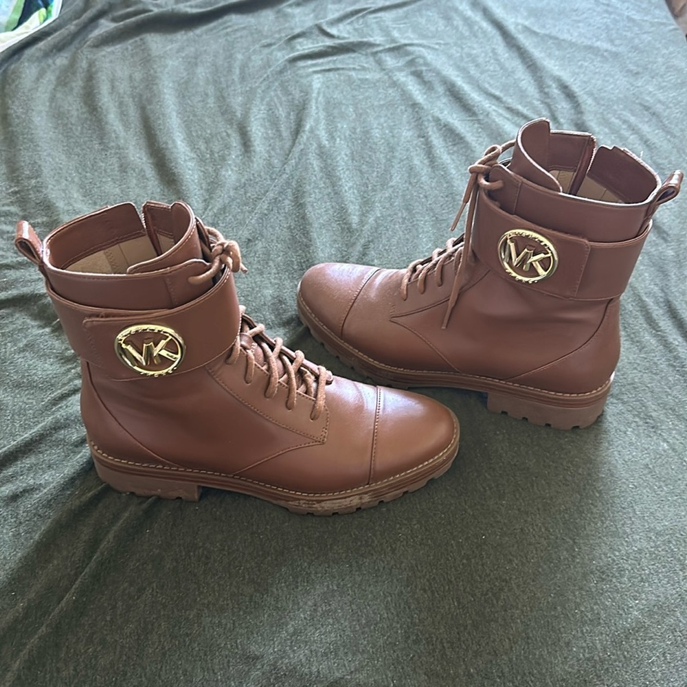 Michael Kors brown zip-up MK buckle boots.